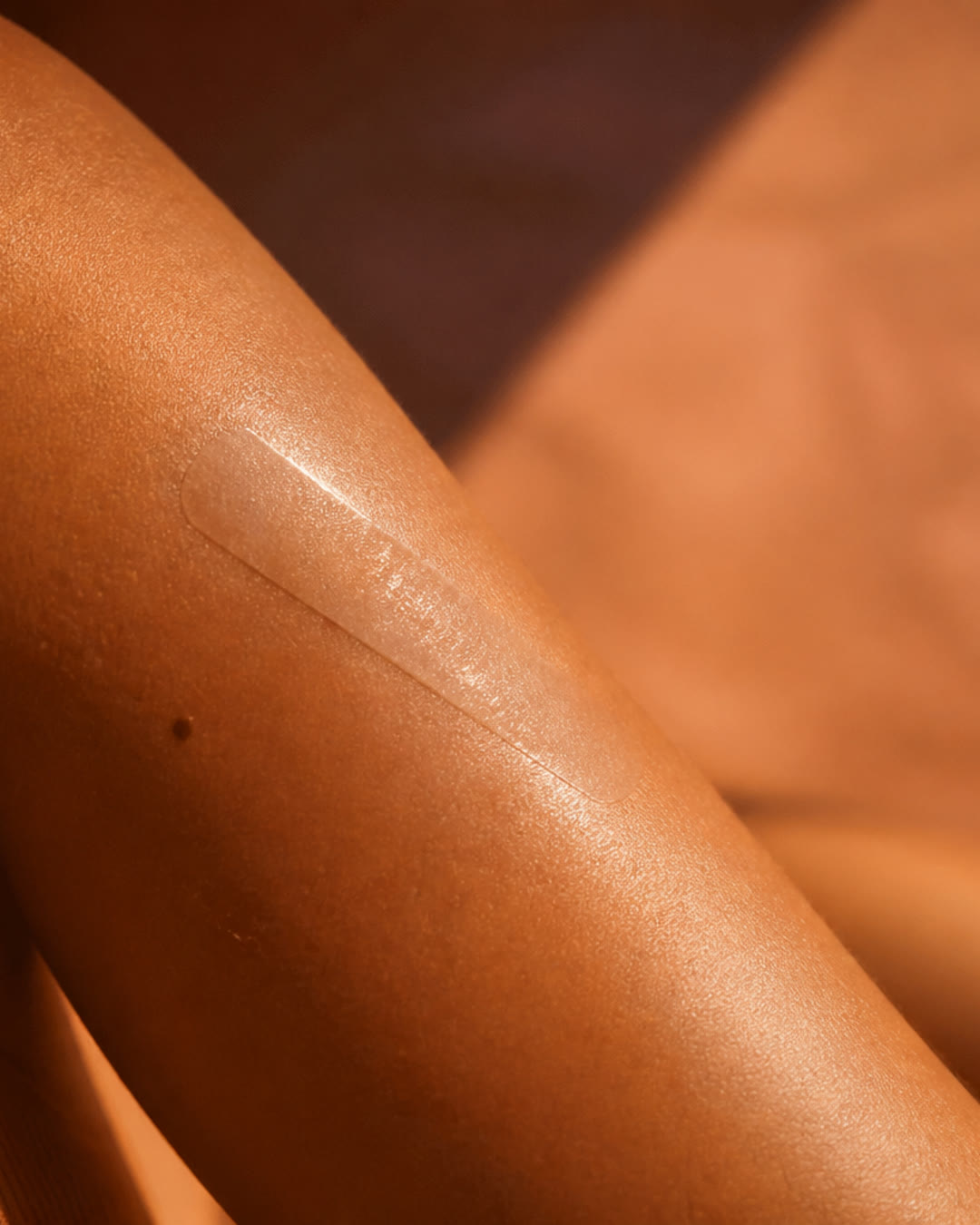 A glossy strip still on the skin